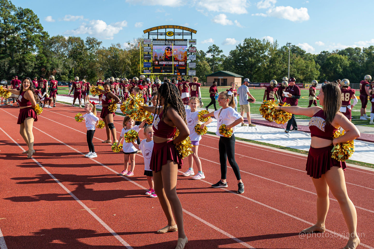 Erskine cheer team members perform alongside young Fleet fans
