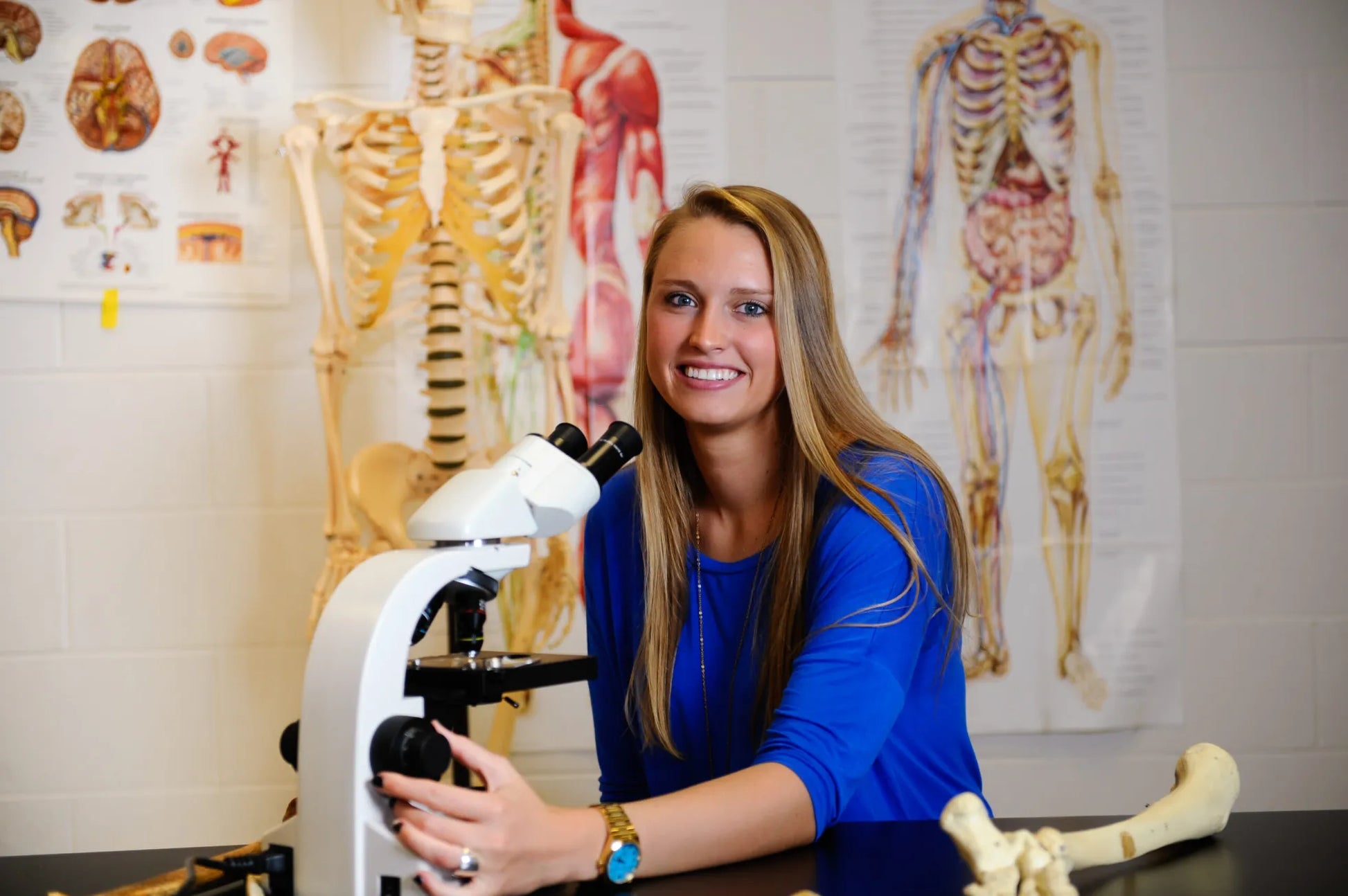 An Erskine student uses a microscope